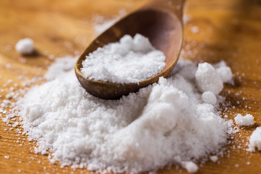 Spoon And Heap Of Salt On The Table