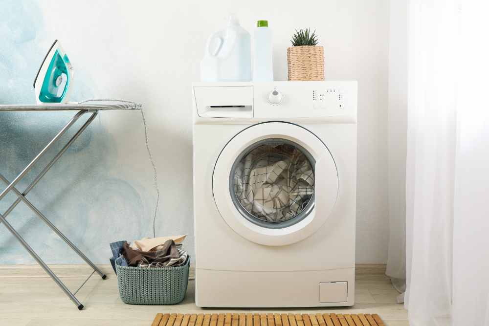 laundry-room-with-washing-machine-against-light-blue-wall