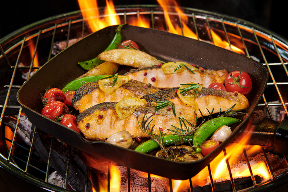 grilled-salmon-fish-with-various-vegetables-pan-flaming-grill-pepper-lemon-salt-herb-decoration