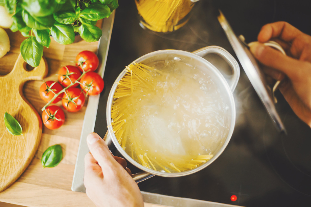 man-cooking-pasta-boiling-water