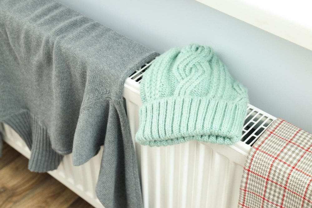 different-winter-clothes-drying-radiator-indoor