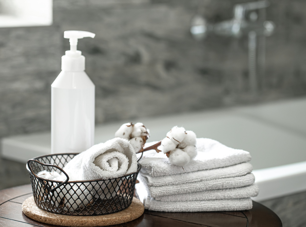 blurred-bathroom-interior-set-clean-folded-towels-copy-space-hygiene-health-concept