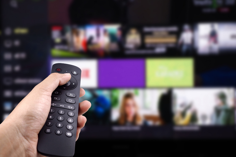 hand-holding-tv-remote-control-with-smart-tv