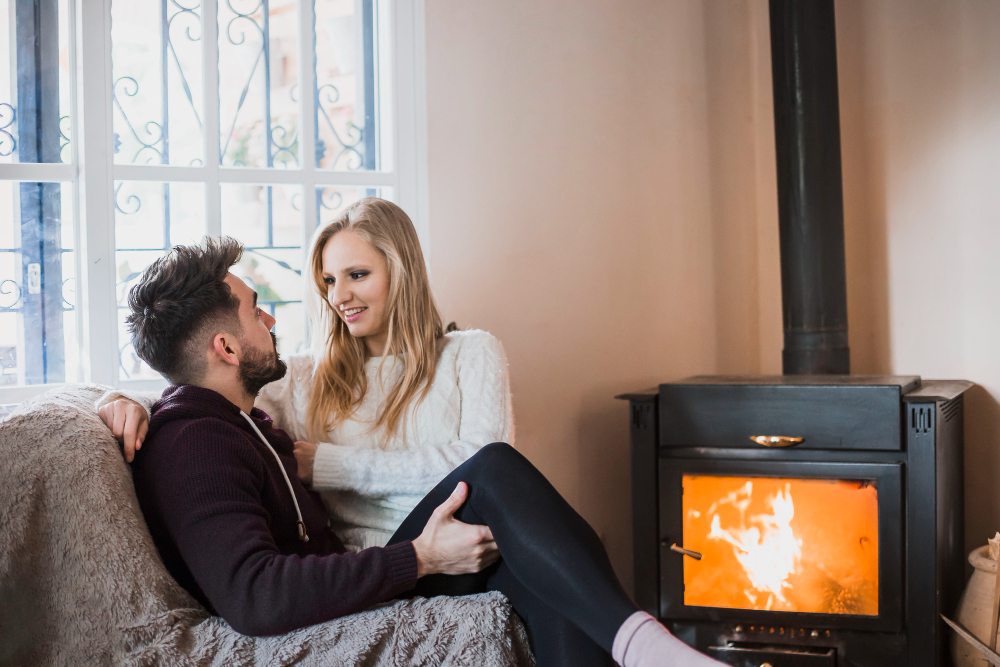 Couple Sitting Near Fireplace