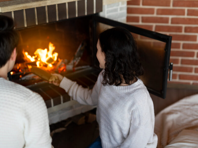 High Angle Woman Putting Wood Fireplace