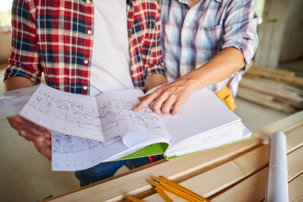 Handsome Young Carpenter Working With Experienced Man