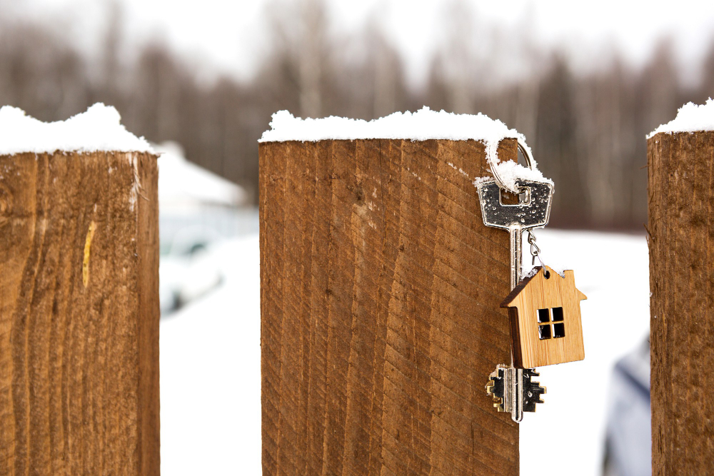 Key House Wooden Fence Winter Snow Gift New Year Christmas Building Design Project Moving New House Mortgage Rent Purchase Real Estate Copy Space