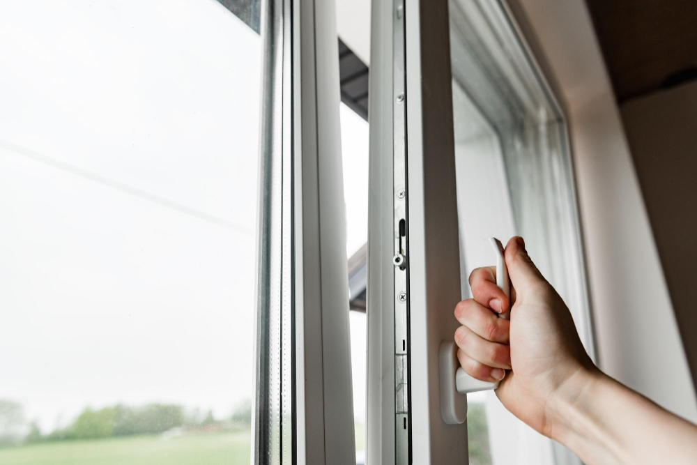 Hand Opens White Plastic Window