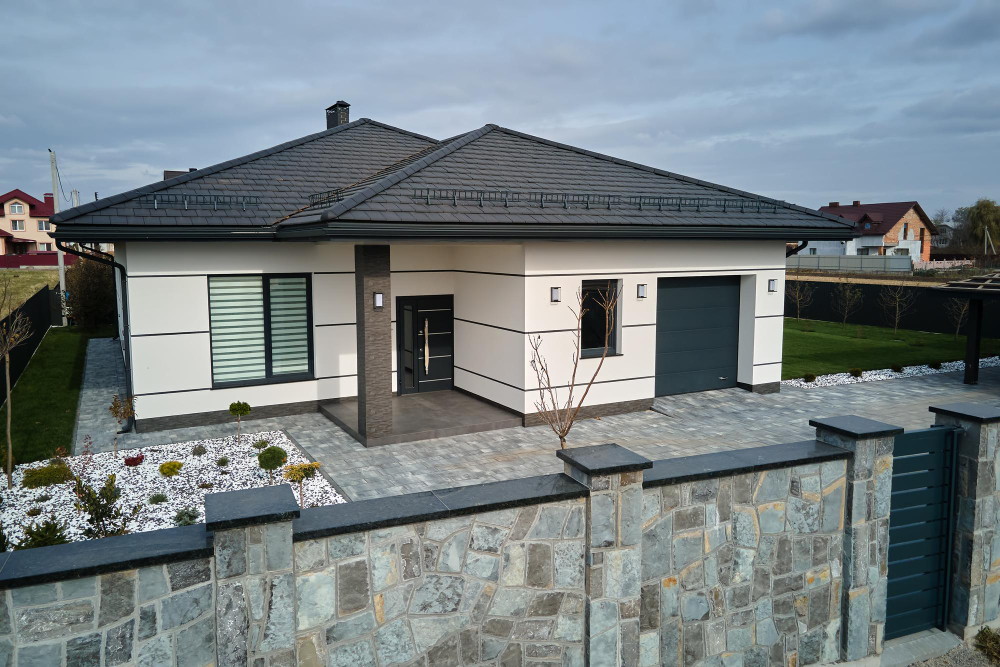 New Residential House Cottage Attached Garage With Big Paved Fenced Yard Sunny Day Modern Suburban Area Real Estate Property Concept