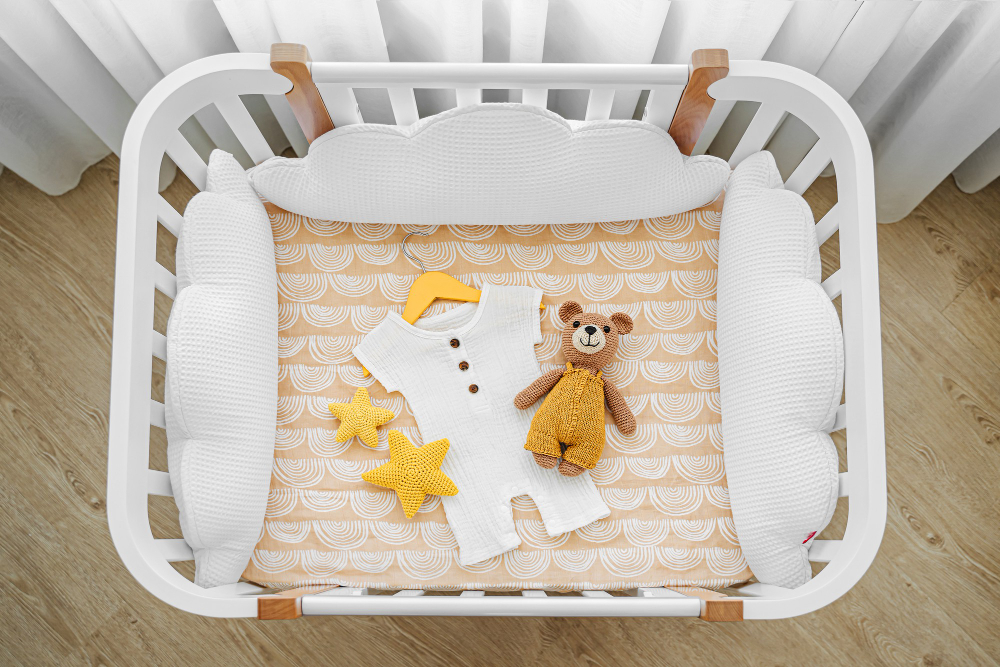 Baby Romper With Toy Bear Newborn Cot Cradle White Wooden Baby Crib With Pillows Shaped Clouds Baby S Room Top View Child S Bed