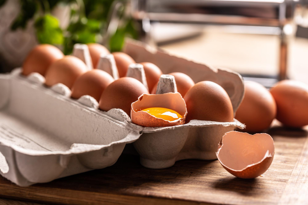 Cardboard Box Full Fresh Chicken Eggs With Yolk Broken Egg Kitchen Counter